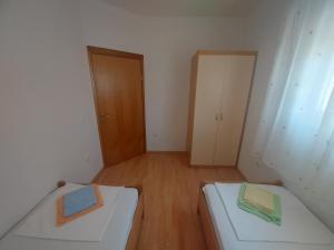 Postel nebo postele na pokoji v ubytování Apartments Pisac