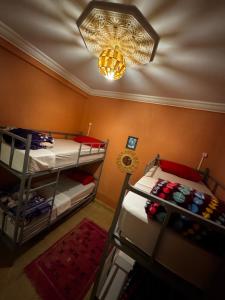 Postel nebo postele na pokoji v ubytování Riad dar Malak