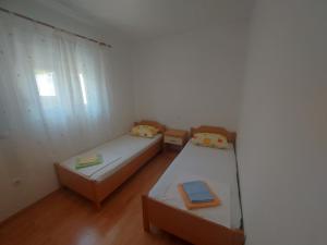 Postel nebo postele na pokoji v ubytování Apartments Pisac