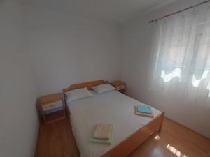Postel nebo postele na pokoji v ubytování Apartments Pisac