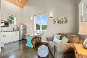 a living room with a couch and a table at Hill Country Casitas in Dripping Springs