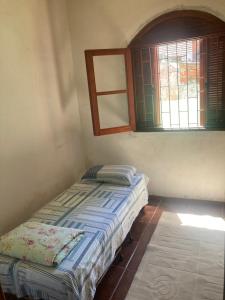 Ένα ή περισσότερα κρεβάτια σε δωμάτιο στο Casa para pernoite 3 quartos