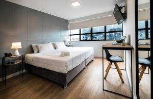 Postel nebo postele na pokoji v ubytování Miraflores Suites Centro