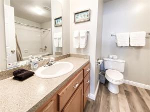 a bathroom with a sink and a toilet at 14-Plex 218 in Garden City +15 photos