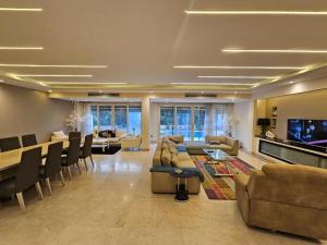 a large living room with couches and a tv at فيلا فاخرة للايجار حمام سباحة التجمع الخامس in Cairo