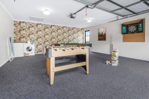a room with a pool table in the middle of it at Pool-Table, Projector, Fooseball -By KOSH BNB in Hamilton +17 photos
