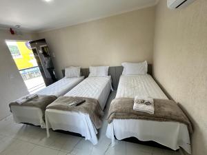 Postel nebo postele na pokoji v ubytování Hotel Aris