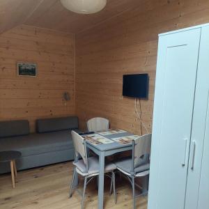 TV a/nebo společenská místnost v ubytování Apartmány U Tří Sluncí + 13 fotografií