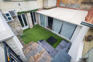 an overhead view of a patio with a couch and a lawn at Nissa la Bella in Nice