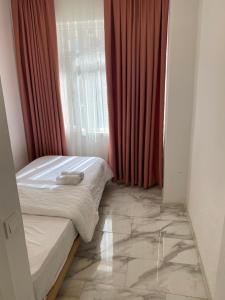 Postel nebo postele na pokoji v ubytování HOTEL YEDİkapı