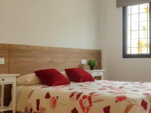 Postel nebo postele na pokoji v ubytování Balcón de las Fuentes