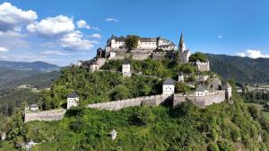 a castle perched on top of a mountain at Stadl-Ferienwohnung in Sankt Georgen am Längsee +12 photos