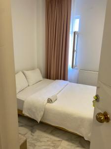 Postel nebo postele na pokoji v ubytování HOTEL YEDİkapı