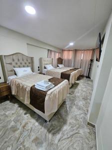 Ένα ή περισσότερα κρεβάτια σε δωμάτιο στο Hotel Sumac Samari