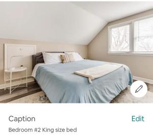 a bedroom with a large bed and a window at Entire Four Bedrooms House Close to Downtown Minneapolis Minneapolis, U of m US Bank Stadium in Minneapolis