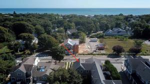 an aerial view of a house with a red arrow at Walk 0 3 Mile to Bank Street Beach in Harwich