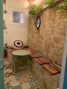 a room with a table and a wall at Old Town Retreat in Rhodes Town