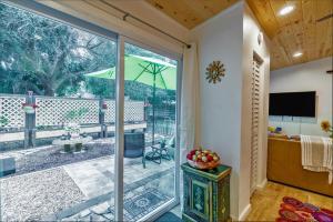 a room with a sliding glass door leading to a patio at The Sapphire Suite in Sarasota