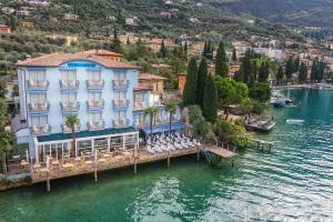 an aerial view of a hotel on the water at Hotel Venezia in Malcesine