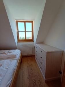 Postel nebo postele na pokoji v ubytování Apartmány Malý mnich