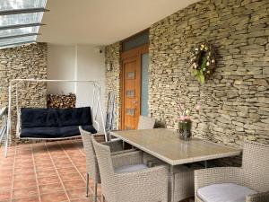a dining room with a table and chairs at Baladise Apartman in Balatonvilágos