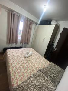 Ένα ή περισσότερα κρεβάτια σε δωμάτιο στο Quarto família Curitiba & SJP