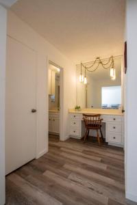 a room with a desk and a mirror at The Wonder Inn - Sleeps 11 near TCU in Fort Worth