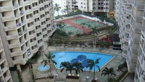 an overhead view of a swimming pool between two buildings at River View Bangkok in Bangkok +31 photos