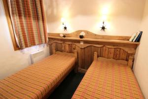 Voodi või voodid majutusasutuse Résidence Diamant - DIAMANT APPARTEMENT 50M² 6 PERS CENTRE STATION MAE-7461 toas