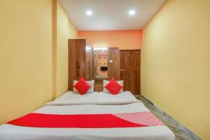 Postel nebo postele na pokoji v ubytování Super Hotel O Priyal Amrit Sagar + 37 fotografií