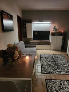 a living room with a couch and a television at Marco Romani in Perugia