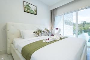 Postel nebo postele na pokoji v ubytování Koh Chang Luxury Pool Villas Premium + 19 fotografií