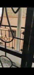 a view of a metal fence with a building at Familly fun in Dakar