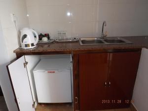 A kitchen or kitchenette at Divers Lodge Guest House