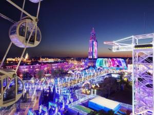 a view of a city at night with a ferris wheel at The Paradise Garden Sasebo - Vacation STAY 90006v in Sasebo +24 photos
