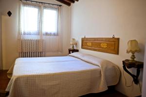 Postel nebo postele na pokoji v ubytování Lionforti Da Vico