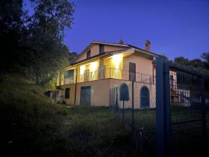 a house with lights on top of it at night at Casa di Farfa in Castelnuovo di Farfa