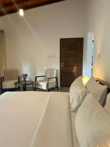 Postel nebo postele na pokoji v ubytování Maho Boutique Hotel