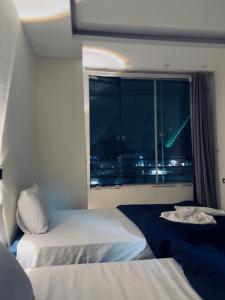 Postelja oz. postelje v sobi nastanitve Aura pyramids view