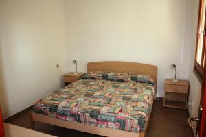 Giường trong phòng chung tại Verande Tanca Torre