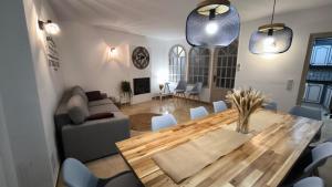 a living room with a wooden table and a couch at El Mirador dels Ports in Paúls