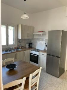 Kuchyň nebo kuchyňský kout v ubytování NAFSIKA Apartments + 32 fotografií