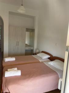Postel nebo postele na pokoji v ubytování NAFSIKA Apartments