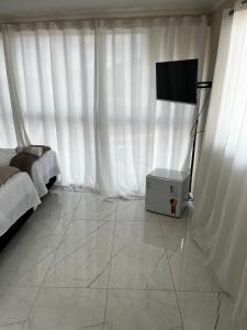 TV a/nebo společenská místnost v ubytování Hotel Aris + 19 fotografií