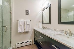 a bathroom with a large sink and a shower at Stratton Mountain Ski House Hot Tub Sauna Shuttle in Stratton Mountain +17 photos