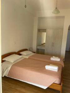 Postel nebo postele na pokoji v ubytování NAFSIKA Apartments