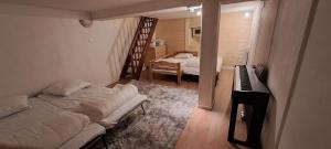 a bedroom with a bed and a piano in a room at La fruitière in Verchaix