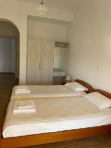 Postel nebo postele na pokoji v ubytování NAFSIKA Apartments