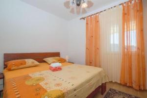 Postel nebo postele na pokoji v ubytování Apartments Mari