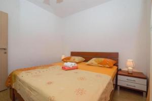 Postel nebo postele na pokoji v ubytování Apartments Mari
